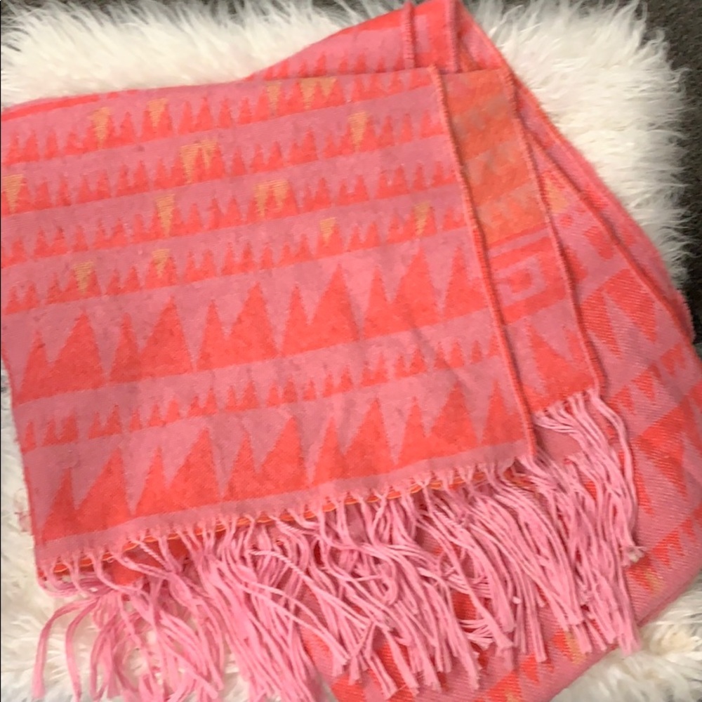 Blanket scarf in light pink with pink graphics.